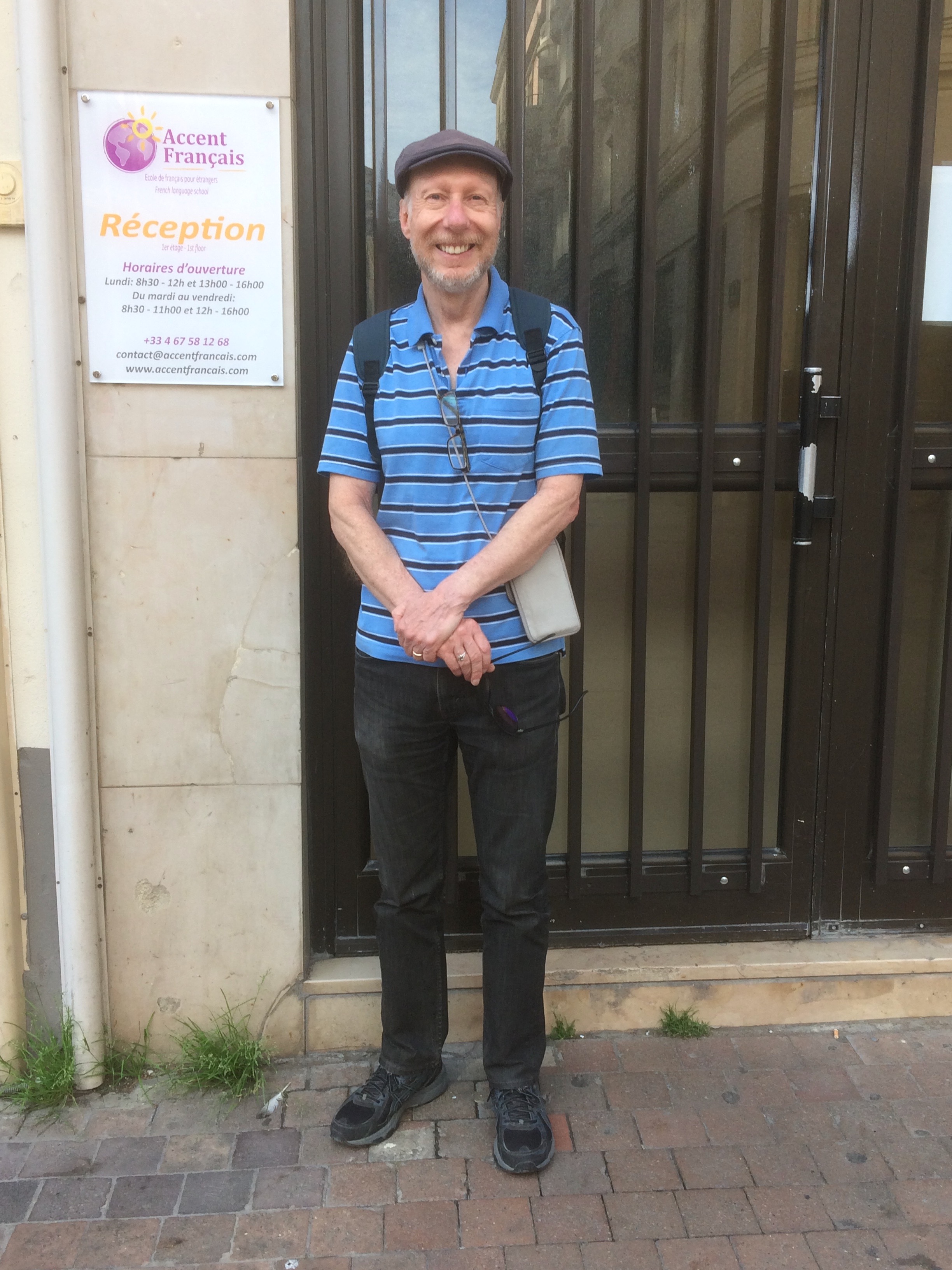 David standing in front of the Accent Français language school